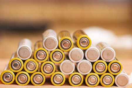 stack of batteries sorted one above the otherの写真素材