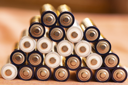 stack of batteries sorted one above the otherの写真素材