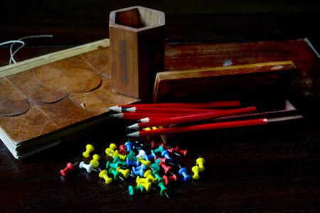 pencils and others stationery objecs on a desk