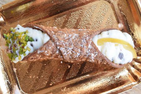 sicilian cannolo with ricotta cream and candied fruitの写真素材