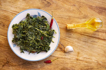 sauteed chicory greens at the roman with oil garlic and hot pepper