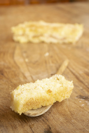 portion of timbale of rice on a wooden spoonの写真素材