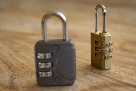 concept of safety with two combination lock on a wooden tableの写真素材