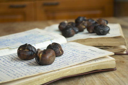 roasted chestnuts resting on a handwritten notebookの写真素材