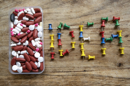the writing idea made with colored pins and pills