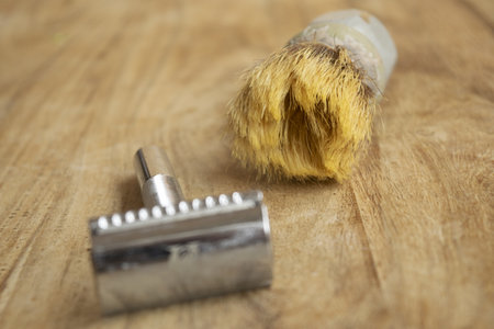 old shaving brush and manual safety razor