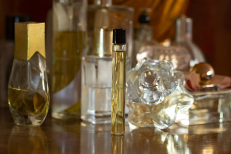 perfume bottle on a wooden cabinet among a number of perfumes