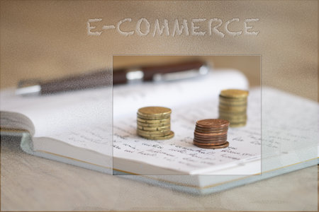 ecommerce concept with writing on a glass and pile of money in the background