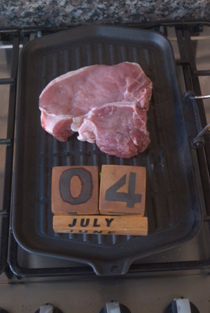 steaks for the 4th of July BBQ on a dishの写真素材