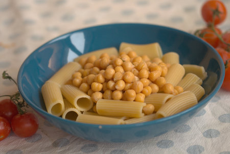 rigatoni pasta and chickpeas in a blue dishの写真素材