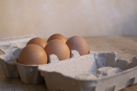 eggs placed in the appropriate cardboard container to prepare an omelet