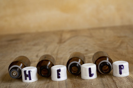 health help concept with the word help written on medicine bottle caps