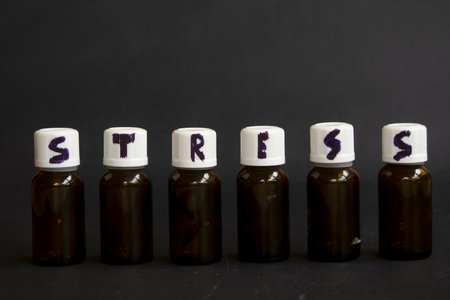 word stress written with a marker on the caps of medicine bottlesの写真素材