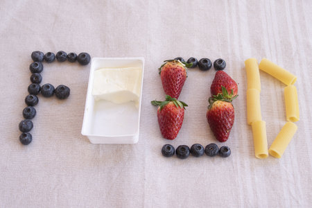 food concept with the word written with various kinds of foodsの写真素材