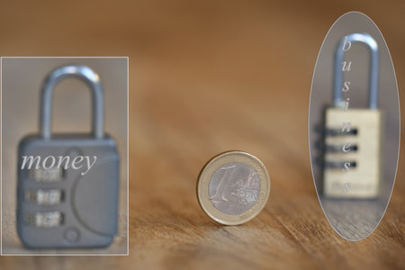 business and money concept with two combination locksの写真素材