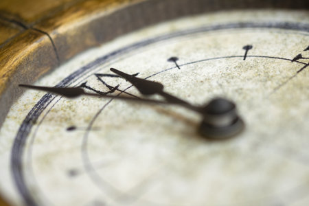 A detailed close-up image of a vintage clock face with ornate hands, showcasing the intricate design...