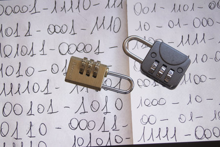 close-up of a handwritten binary code with two combination padlocks, symbolizing digital security...