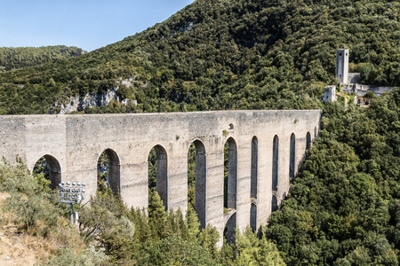 The Bridge of the Towers an aqueduct bridge probably of Roman origin, which connects the hill of Sant'Elia to Monteluco to the south of Spoleto. It is one of the most famous and picturesque monuments in the city.の写真素材