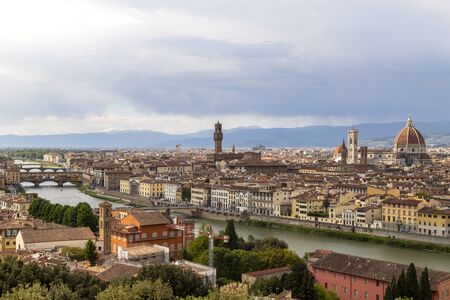 view of the historic center of Florence from Piazzale Michelangelo, where you can see the Cathedral of Santa Maria del Fiore, old palace and old bridge.の写真素材