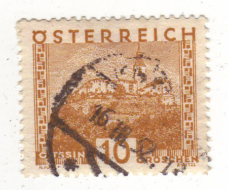 the image of a castle with a tower on a brown brand, price 10.の写真素材