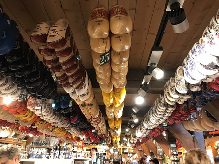 Amsterdam, The Netherlands - August 02, 2018: Traditional Wooden Dutch Shoes Hanging on the Ceiling of a Shopのeditorial素材