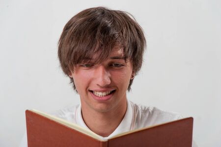 Young man with bookの写真素材