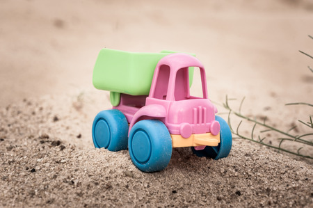 Toy dump-truck in the sands, summer, dayの写真素材