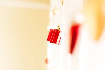 Christmas decoration, bright red box on ribbonの写真素材