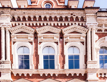 Old building of red bricks with white windows
の写真素材