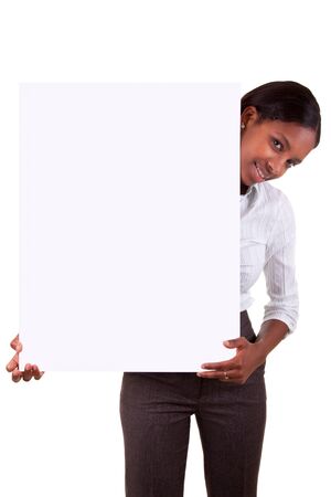 Young black  woman showing an advertisementの写真素材