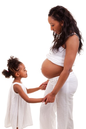Pregnant black woman with her daughterの写真素材