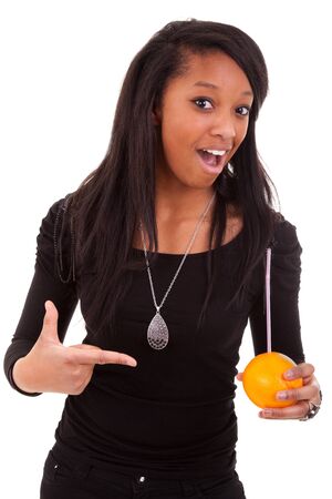 young black woman drinking orange juiceの写真素材