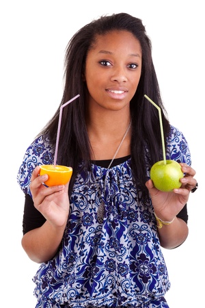 Young black girl holding fruitsの写真素材