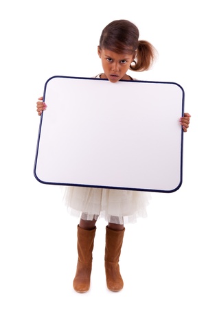 Cute little african american girl holding a whiteboard, isolated on white backgroundの写真素材