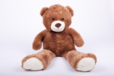 Seated teddy bear , over a white backgroundの写真素材