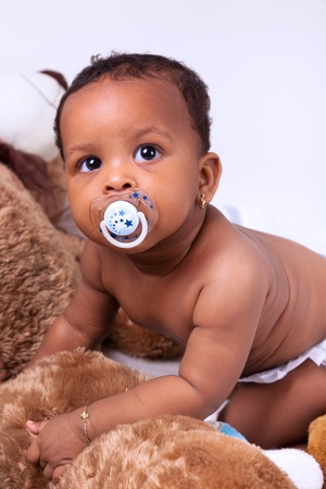 Adorable little african american baby girl  looking upの写真素材