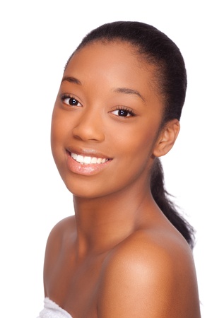 Portrait of a young beautiful african woman, Isolated over white backgroundの写真素材