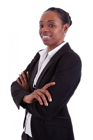 Smiling african american businesswoman with folded arms, isolated on white backgroundの写真素材