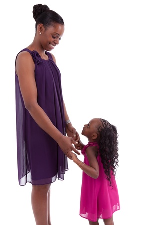Happy african mother with her daughter, isolated on white backgroundの写真素材