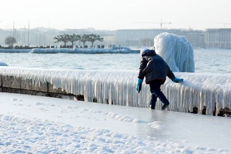 Children playing outside in winter in Genevaの写真素材