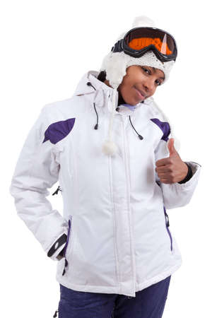 Young african woman in ski clothes making thumbs up, isolated on white backgroundの写真素材