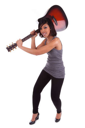 Young black woman breaking a guitar, isolated on white backgroundの写真素材