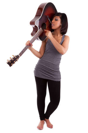 Young black woman playing guitar, isolated on white backgroundの写真素材