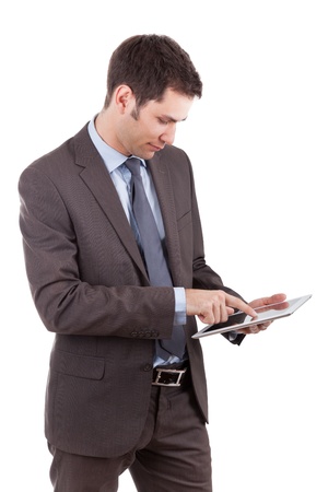 Young caucasian businessman using a tablet pc,isolated on white backgroundの写真素材