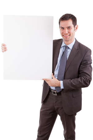 Young caucasian businessman holding a white board, isolated on whitebackgroundの写真素材