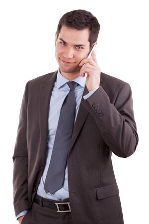 Portrait of a young caucasian business man using a mobile phone,isolated on white backgroundの写真素材