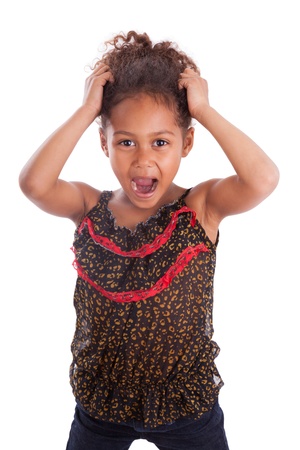 Little African Asian girl holding her head,  over white backgroundの写真素材