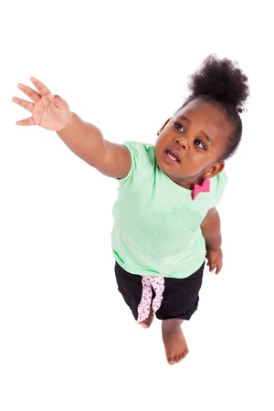 Cute little african american girl looking up, isolated on white backgroundの写真素材