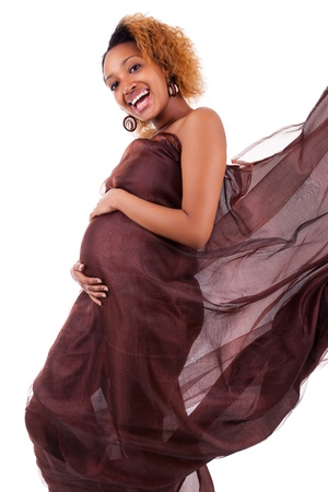 Young beautiful pregnant african woman , over white backgroundの写真素材