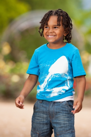 Outdoor portrait of a cute african american little boyの写真素材